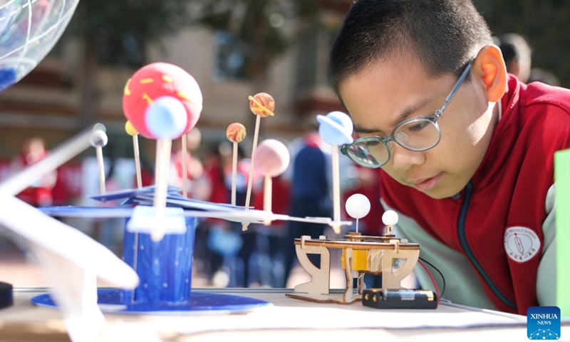 A student attends a science and technology festival at a middle school in Urumqi, northwest China's Xinjiang Uygur Autonomous Region, Oct. 14, 2026. (Photo: Xinhua)