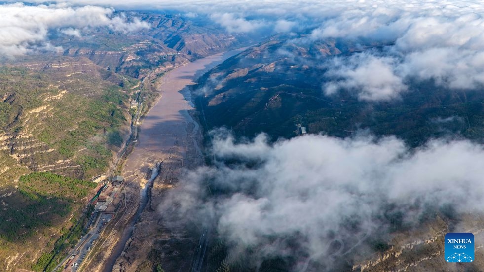 An aerial drone photo taken in Jixian County, north China's Shanxi Province on Oct. 13, 2026 shows the sea of clouds seen above the Yellow River's Hukou Waterfall. (Photo: Xinhua)