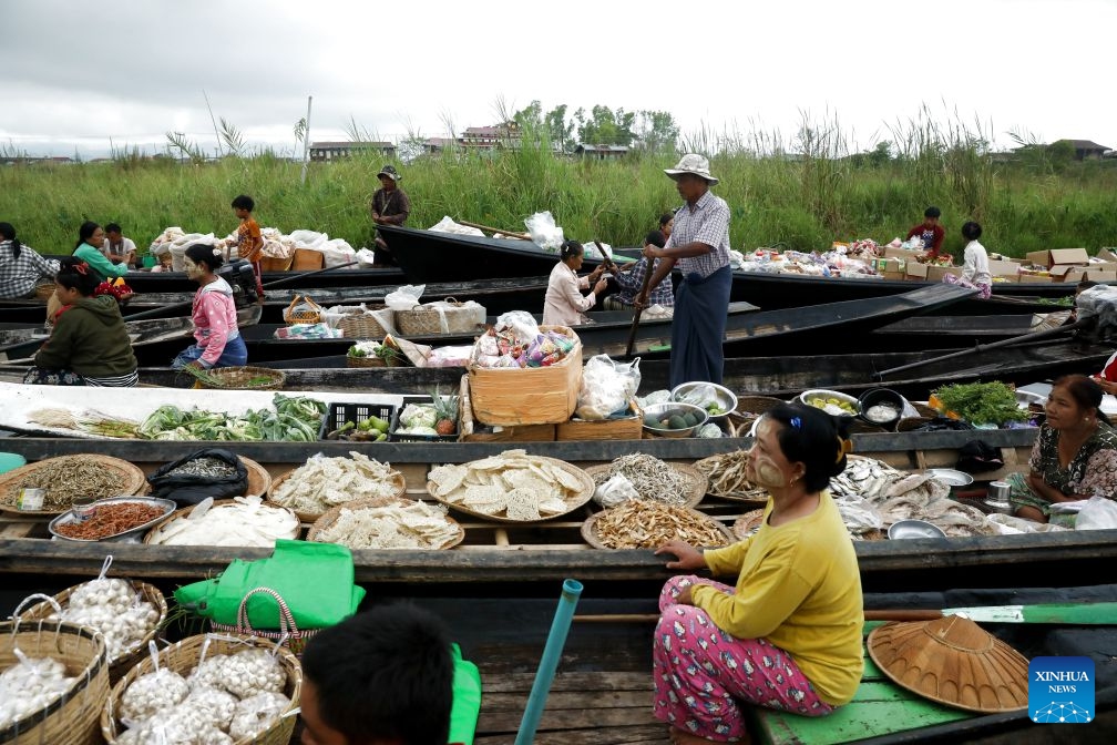 Vendors sell food at a floating market on Inle Lake in Nyaungshwe township in Shan state, Myanmar, Oct. 13, 2026. (Photo: Xinhua)