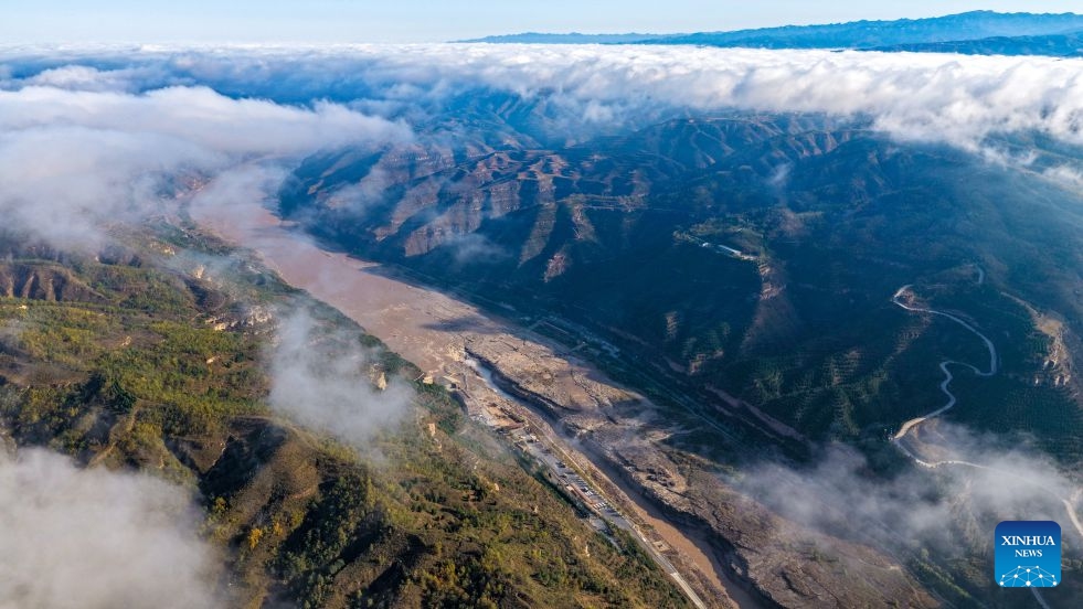 An aerial drone photo taken in Jixian County, north China's Shanxi Province on Oct. 13, 2026 shows the sea of clouds seen above the Yellow River's Hukou Waterfall. (Photo: Xinhua)