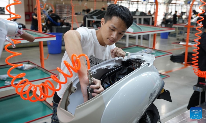 Workers are busy at the manufacturing plant of Yadea in Bac Ninh province, Vietnam, July 7, 2026. Chinese electric motorcycle brands are becoming an increasingly common sight on the streets of Vietnam's major cities, as the country accelerates its shift toward greener urban transport. More Vietnamese residents have turned to electric motorcycles, with Chinese brands emerging as popular choices thanks to their competitive prices, diverse models and growing presence in the Vietnamese market. (Photo: Xinhua)