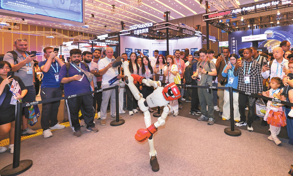 Visitors watch a robot boxing demonstration at the 140th Canton Fair in Guangzhou, South China's Guangdong Province, on October 15, 2026. Marking its 70th anniversary, the fair brings together more than 30,000 exhibitors and is expected to attract about 340,000 overseas buyers. Photo: VCG