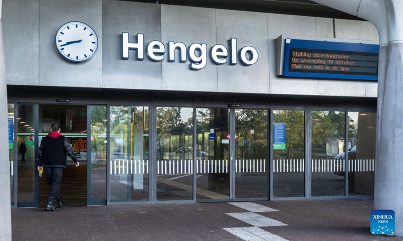 A man enters a station in Hengelo, the Netherlands, Oct. 14, 2026. Regional public transport services across most of the country were disrupted by strikes on Wednesday for demanding better working conditions and employee welfare. (Photo: Xinhua)