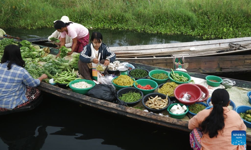 Vendors sell food at a floating market on Inle Lake in Nyaungshwe township in Shan state, Myanmar, Oct. 13, 2026. (Photo: Xinhua)