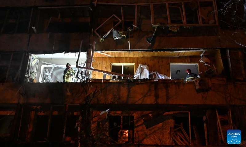 Rescuers work at a residential building after a strike in Kiev, Ukraine, Oct. 14, 2026. (Photo: Xinhua)
