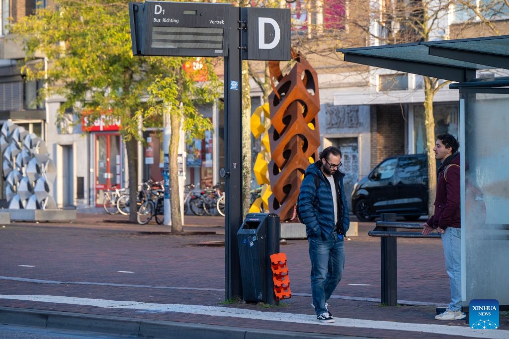 People are seen at a platform in Hengelo, the Netherlands, Oct. 14, 2026. Regional public transport services across most of the country were disrupted by strikes on Wednesday for demanding better working conditions and employee welfare. (Photo: Xinhua)