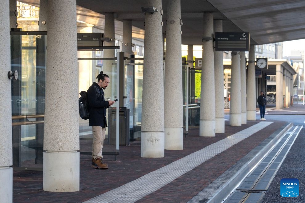 A man is seen at a platform in Hengelo, the Netherlands, Oct. 14, 2026. Regional public transport services across most of the country were disrupted by strikes on Wednesday for demanding better working conditions and employee welfare. (Photo: Xinhua)