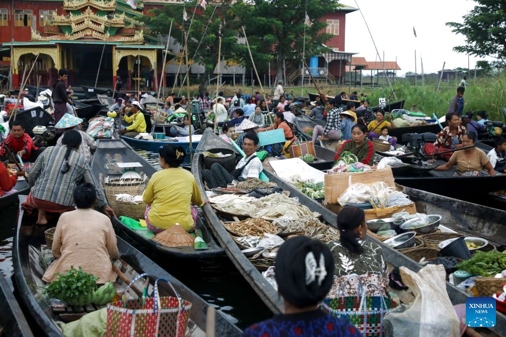 Vendors sell food at a floating market on Inle Lake in Nyaungshwe township in Shan state, Myanmar, Oct. 13, 2026. (Photo: Xinhua)