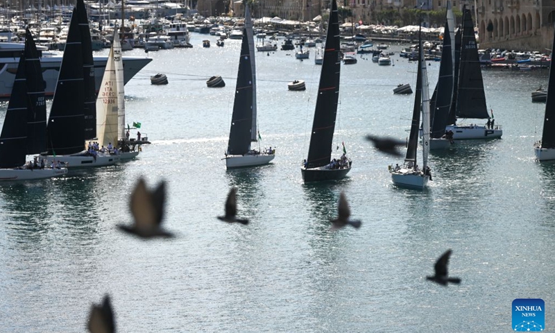 Yachts are seen sailing from the Grand Harbour of Malta, port of Valletta, during the 47th Rolex Middle Sea Race in Valletta, Malta, on Oct. 17, 2026. (Photo by Jonathan Borg/Xinhua)