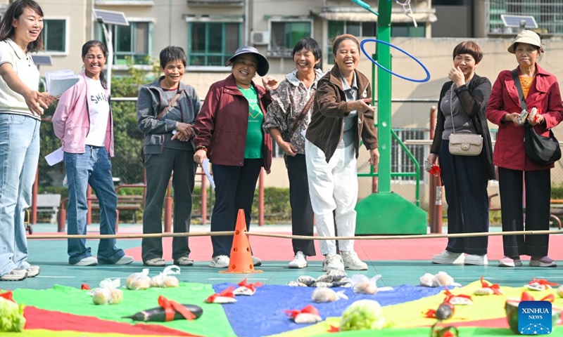 The elderly participate in a fun game at a community of Wudang District in Guiyang, southwest China's Guizhou Province, Oct. 16, 2026. In recent years, Guizhou has been continuously improving its elderly care service system, with many places upgrading community-based elderly care service stations to provide heartwarming services such as community meal aid, free health consultations, and cultural and recreational activities. (Photo by Yuan Fuhong/Xinhua)