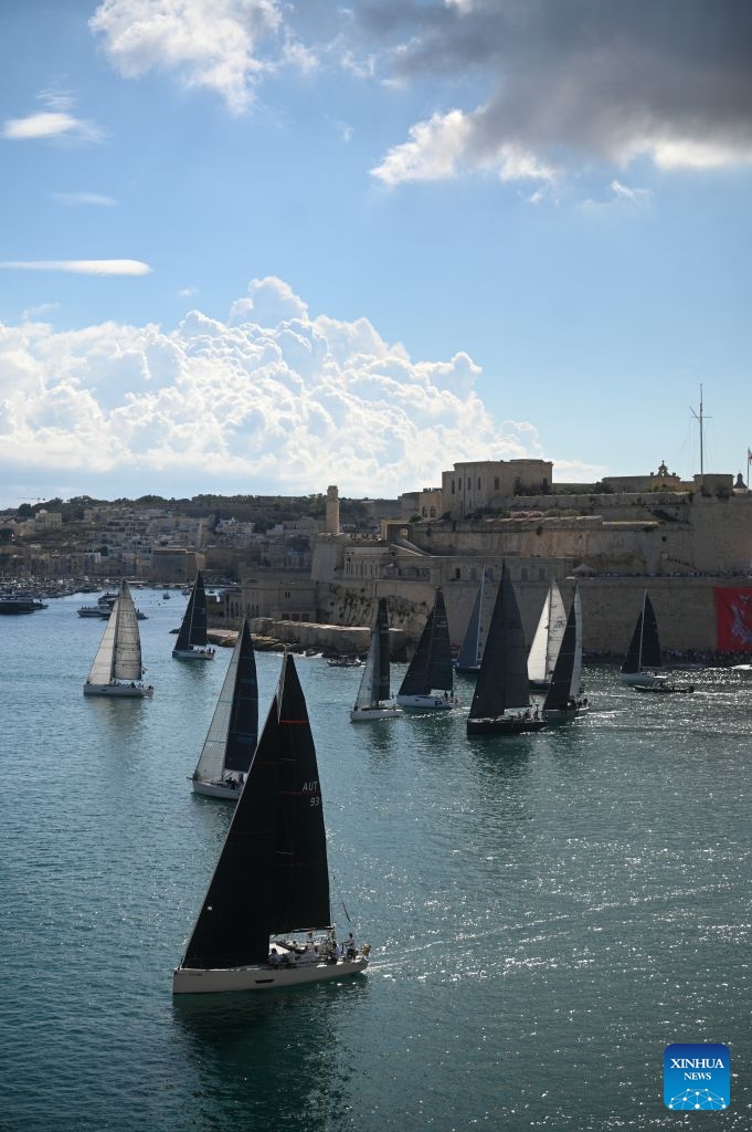 Yachts are seen sailing from the Grand Harbour of Malta, port of Valletta, during the 47th Rolex Middle Sea Race in Valletta, Malta, on Oct. 17, 2026. (Photo by Jonathan Borg/Xinhua)