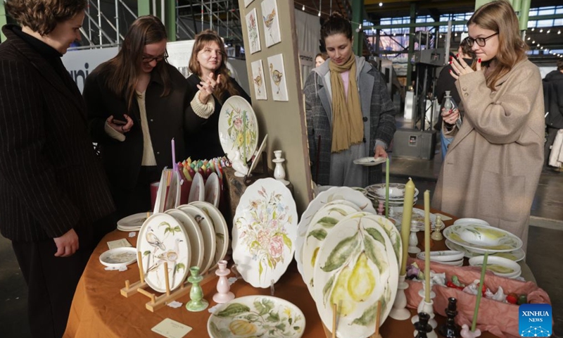 Visitors check ceramic works during a ceramics exhibition in St. Petersburg, Russia, Oct. 17, 2026. The Russian city of St. Petersburg hosted a two-day ceramics exhibition. More than 150 artists from over 20 cities across Russia showcase their creative ceramic works. (Photo by Irina Motina/Xinhua)