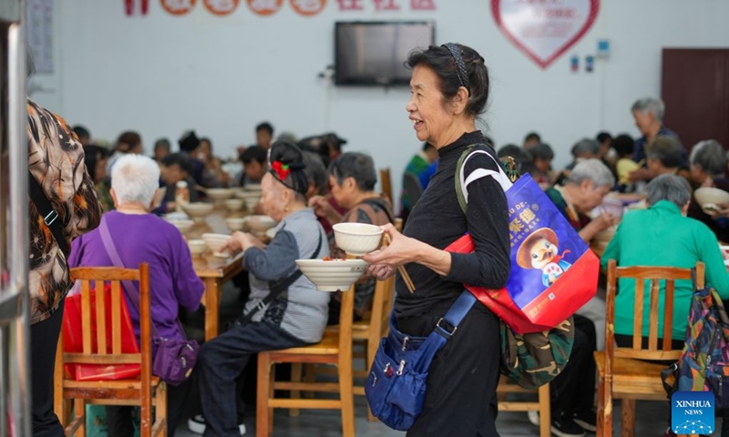 The elderly dine at a community canteen of Ximen Street in Kaili City, southwest China's Guizhou Province, Oct. 17, 2026. In recent years, Guizhou has been continuously improving its elderly care service system, with many places upgrading community-based elderly care service stations to provide heartwarming services such as community meal aid, free health consultations, and cultural and recreational activities. (Photo by Cai Xingwen/Xinhua)