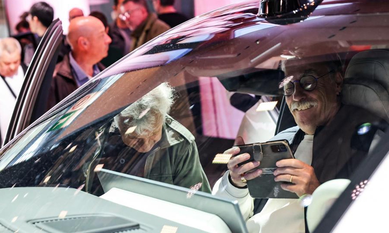 Visitors try out a vehicle at the booth of Chinese automaker Li Auto during the 2026 Paris Motor Show in Paris, France, on Oct. 13, 2026. (Xinhua/Wu Huiwo)

