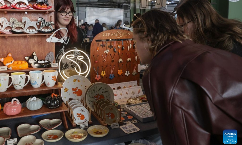 Visitors check ceramic works during a ceramics exhibition in St. Petersburg, Russia, Oct. 17, 2026. The Russian city of St. Petersburg hosted a two-day ceramics exhibition. More than 150 artists from over 20 cities across Russia showcase their creative ceramic works. (Photo by Irina Motina/Xinhua)