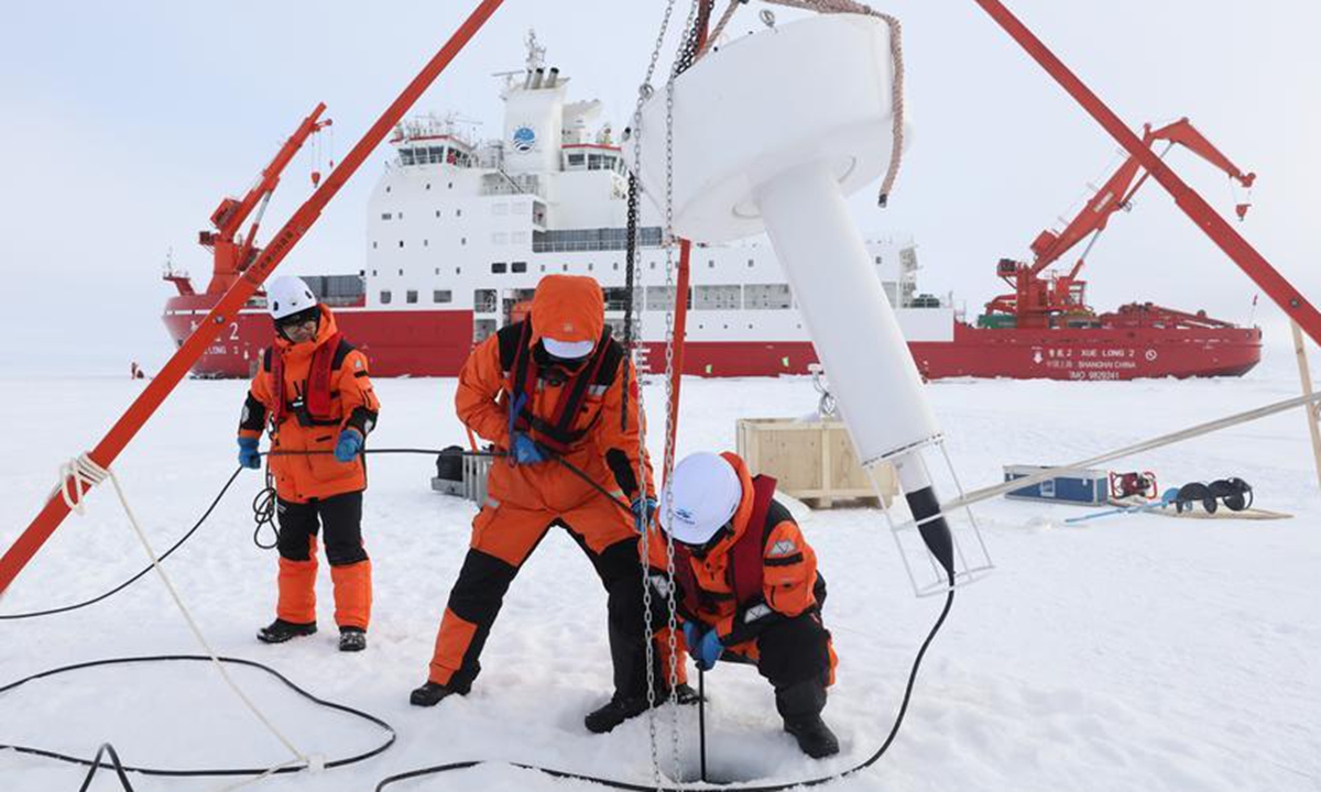 Members of China's 16th Arctic Ocean scientific expedition team work on the ice surface of the Arctic Ocean on Aug. 9, 2026. Photo: Xinhua