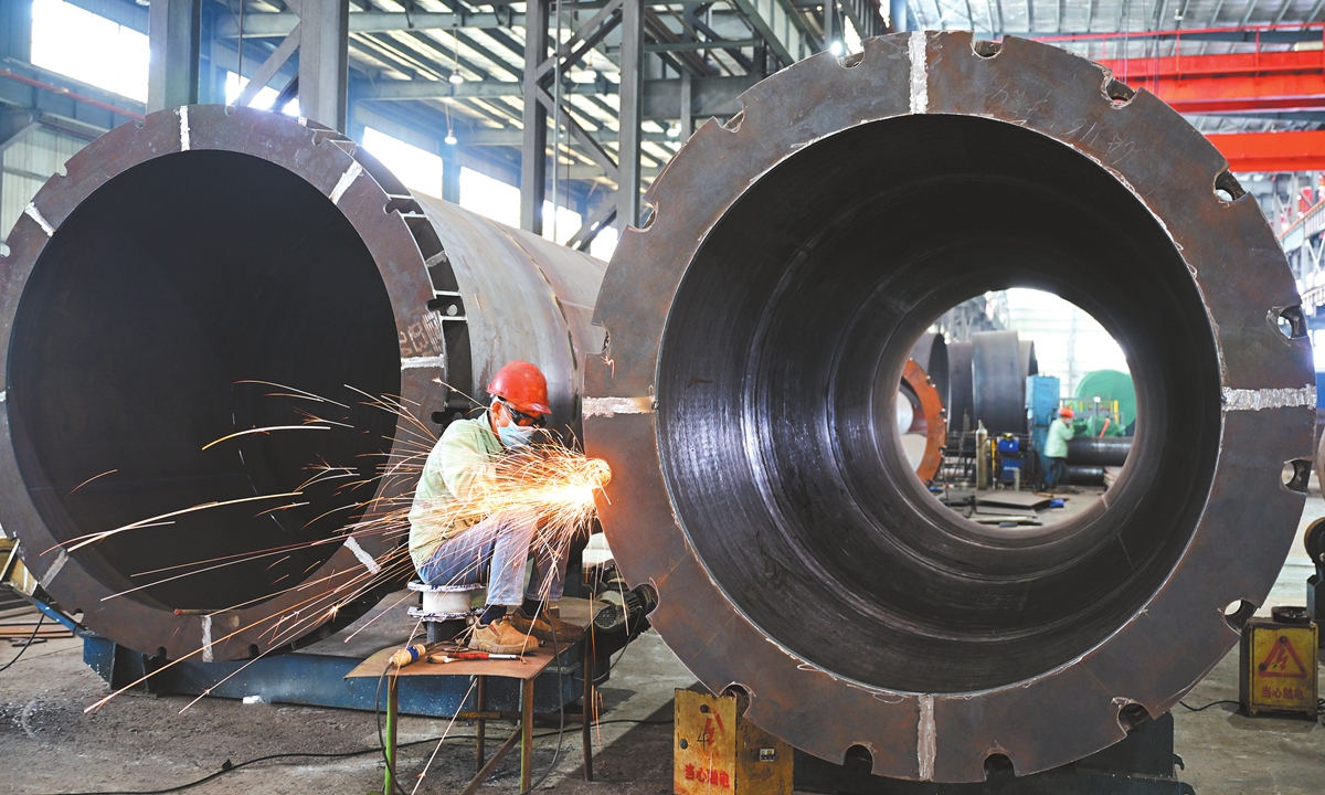 A worker makes customized pressure vessel equipment at a pressure vessel company in the high-tech zone of Haian, East China's Jiangsu Province, on October 20, 2026. As the fourth quarter gets underway, local manufacturers are ramping up production and racing to fulfill orders in a final push to meet their annual targets. Photo: CNS Photo