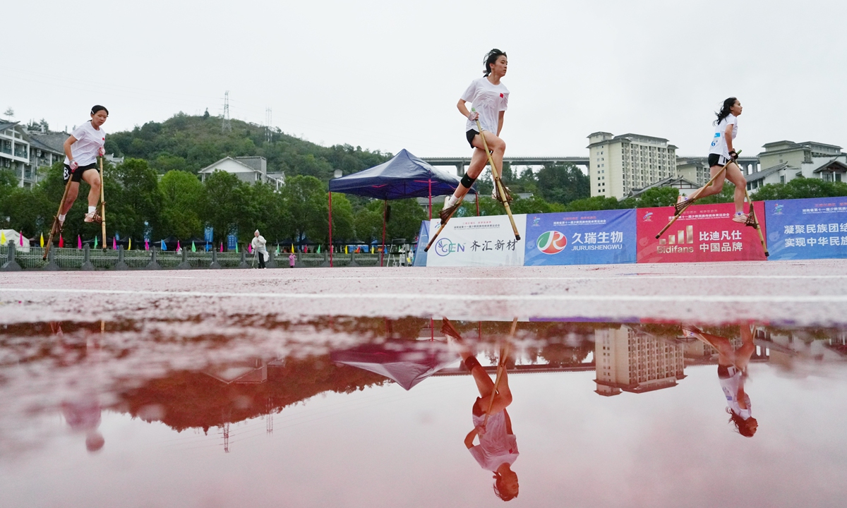 Participants compete in the stilt racing event at the 11th Traditional Games of Ethnic Minorities of Hunan Province in Zhangjiajie, Central China's Hunan Province, on October 20, 2026. A total of 3,500 participants across 31 delegations from the province's 14 prefecture-level cities and 17 county-level regions are participating in the games. Photo: VCG