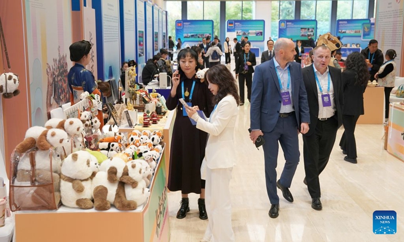 Guests visit an exhibition on the sidelines of the opening ceremony of the 2026 China International Friendship Cities Conference in Xi'an, northwest China's Shaanxi Province, on Oct. 21, 2026. Themed Jointly Strengthening Friendship Cities Cooperation for Common Urban Development, the conference kicked off here on Wednesday. (Photo: Xinhua)