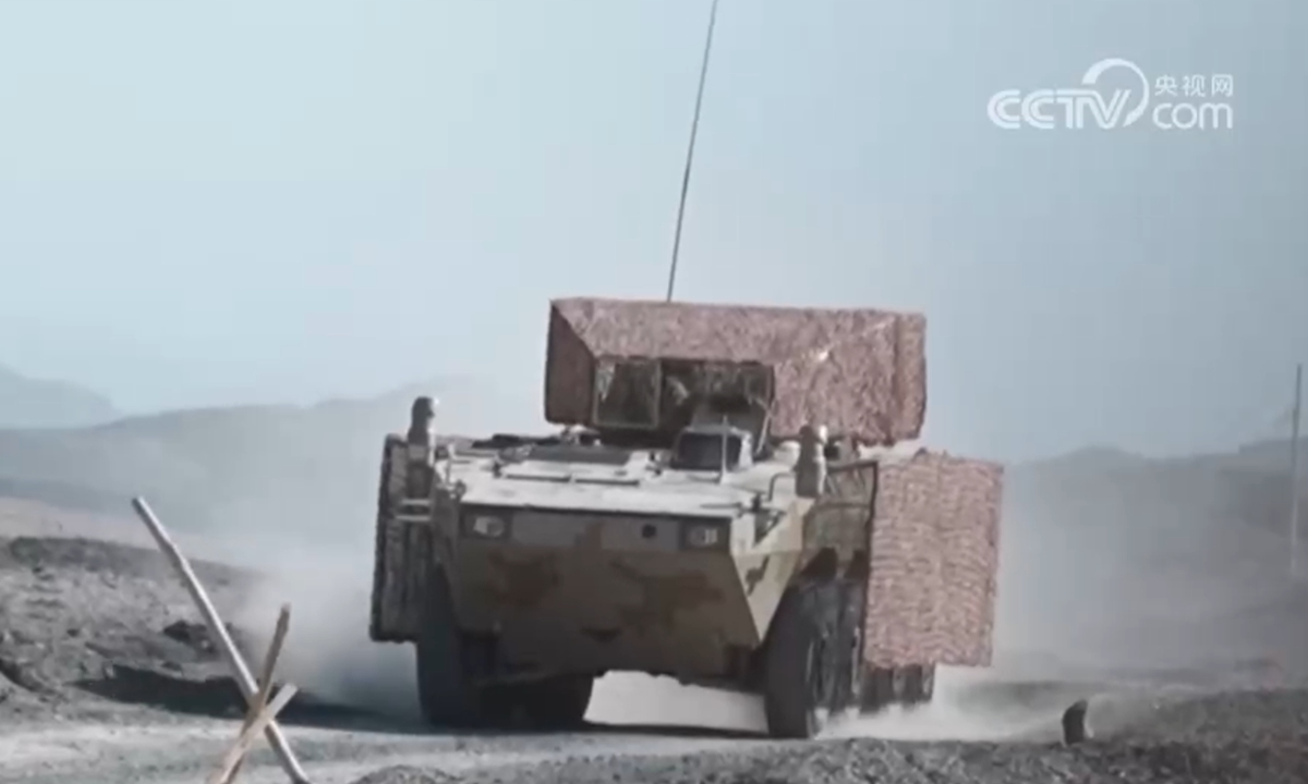 A Type 08 infantry fighting vehicle fitted with a roof cage and side grilles drives down a road during the China-Pakistan Karakoram 2026 joint army training in Korla, Northwest China's Xinjiang Uygur Autonomous Region. Photo: Screenshot from the CCTV News