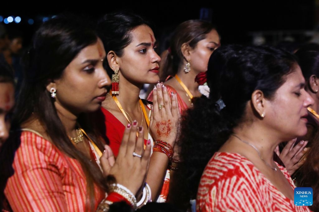 Devotees pray during the Durga Puja, one of the largest Hindu festivals, in Yangon, Myanmar, Oct. 20, 2026. (Photo: Xinhua)