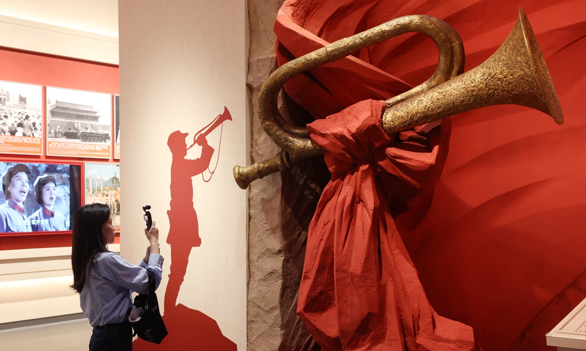 A visitor explores a themed exhibition commemorating the 90th anniversary of the victory of the Long March in Beijing. Photo: Cui Meng/Global Times