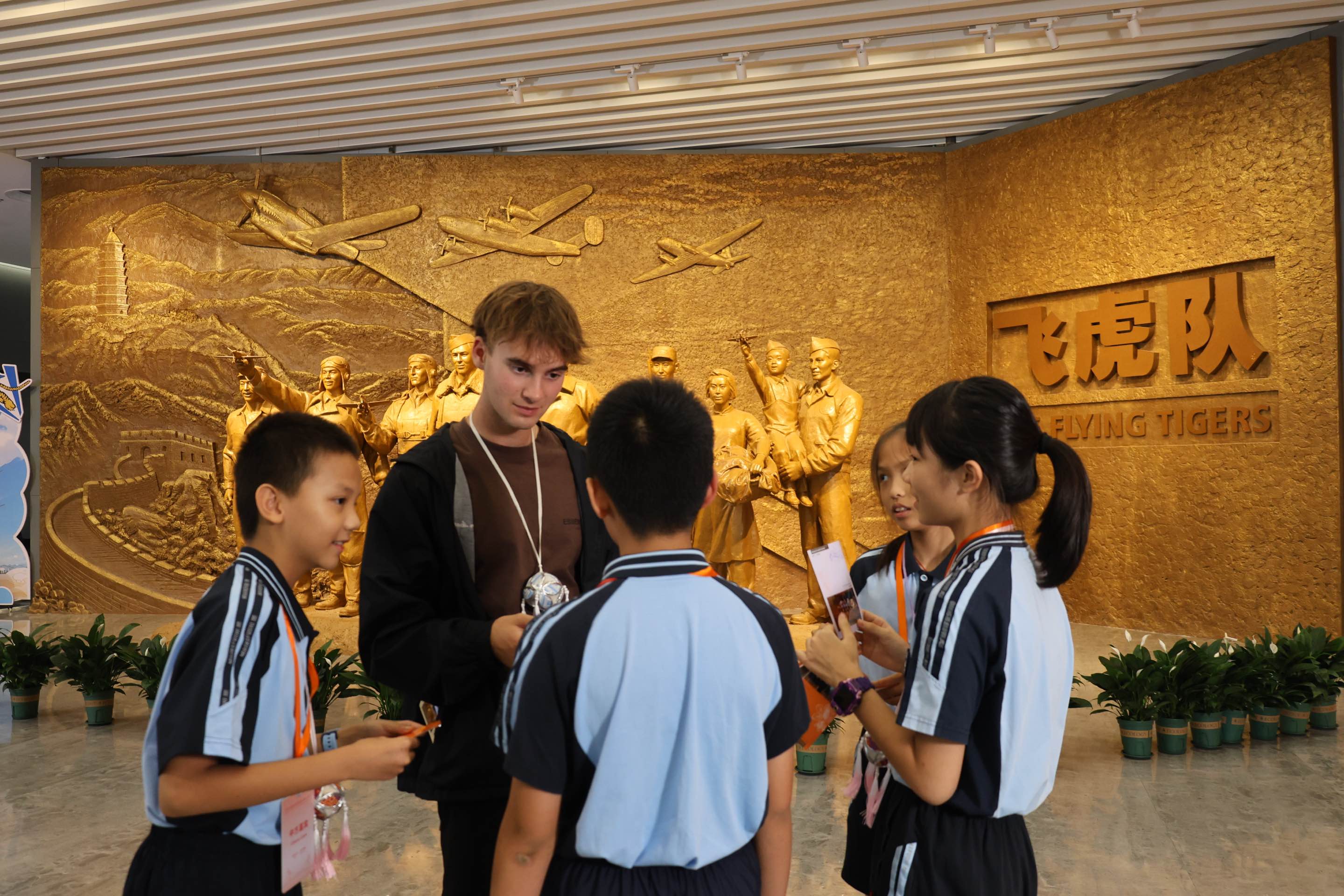 Chinese and American students interact at a Flying Tigers exhibition in Liuzhou, Guangxi, on July 20, 2026, honoring China-US wartime cooperation. Photo: VCG