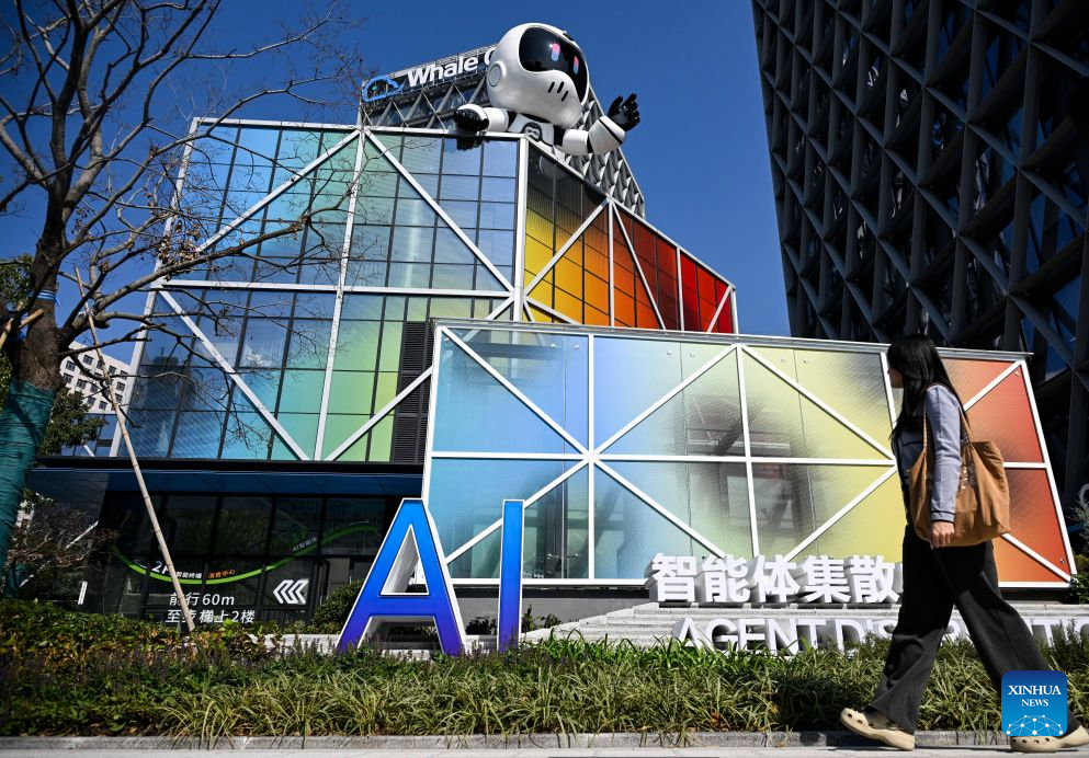 A woman walks past the Nanjing AI Agent Distribution Center in Nanjing, east China's Jiangsu Province, Oct. 26, 2026.
The Nanjing AI Agent Distribution Center is an integrated platform for the display and supply-demand matching of AI applications and technologies. (Xinhua/Ji Chunpeng)