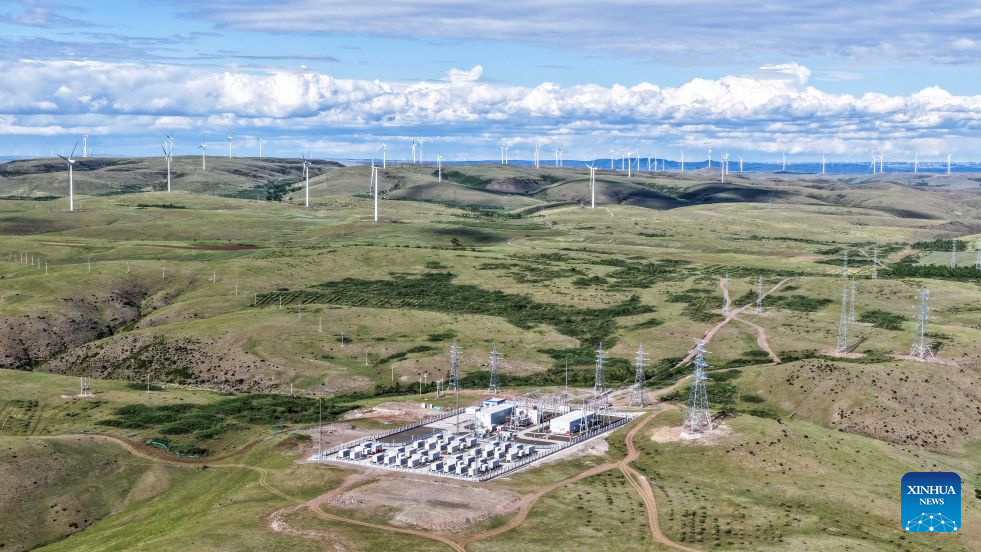 A drone photo taken on June 9, 2026 shows a wind farm and an energy storage power station in Ulanqab, north China's Inner Mongolia Autonomous Region. By the end of September 2026, China's cumulative installed capacity of wind and solar power reached 2.01 billion kilowatts, the country's National Energy Administration announced on Monday. Of the total, solar power capacity stood at 1.31 billion kilowatts, up 16.5 percent year on year, while wind power capacity reached 700 million kilowatts, up 20.4 percent. (Xinhua/Lian Zhen)