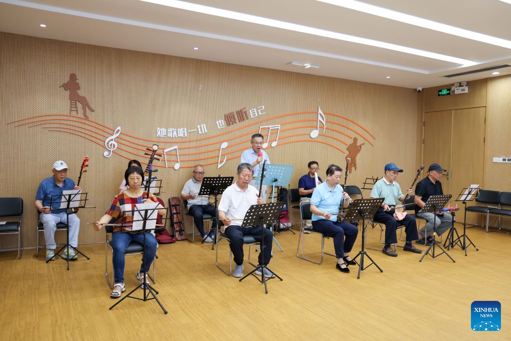 A band rehearses in the rehearsal room of Beizhan community public service center in Longhua District of Shenzhen, south China's Guangdong Province, Oct. 25, 2026. Shenzhen has been steadily improving the network and functions of its community public service centers since 2015, and has now built more than 4,400 such centers of various types. With each center covering a roughly one-kilometer, 15-minute walking radius, the network delivers all-age-friendly services to local residents, tourists, and foreign visitors.

In recent years, the centers have regularly hosted a rich variety of cultural and recreational activities, and provided amenities including public reading rooms, nursery facilities and community canteens. Receiving over 400,000 visits every day across the network, they function as both convenient public service platforms and venues for community consultation and exchanges, bringing greater warmth to community-level urban governance. (Xinhua/Liang Xu)