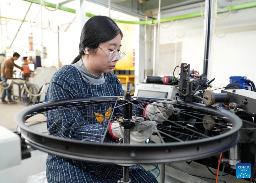 A staff member operates at the workshop of a bicycle enterprise in Lutai economic development zone of Tangshan City, north China's Hebei Province, Oct. 28, 2026. In recent years, Lutai economic development zone in Tangshan City has continuously promoted the upgrading of its bicycle industry. Local manufacturers are encouraged to expand their operation from mere production of components to development and production of ready-for-use bicycles. There are 55 of such manufacturers in this district, covering production of bicycles, bicycle parts, and motors for electric two-wheelers. (Xinhua/Yang Shiyao)