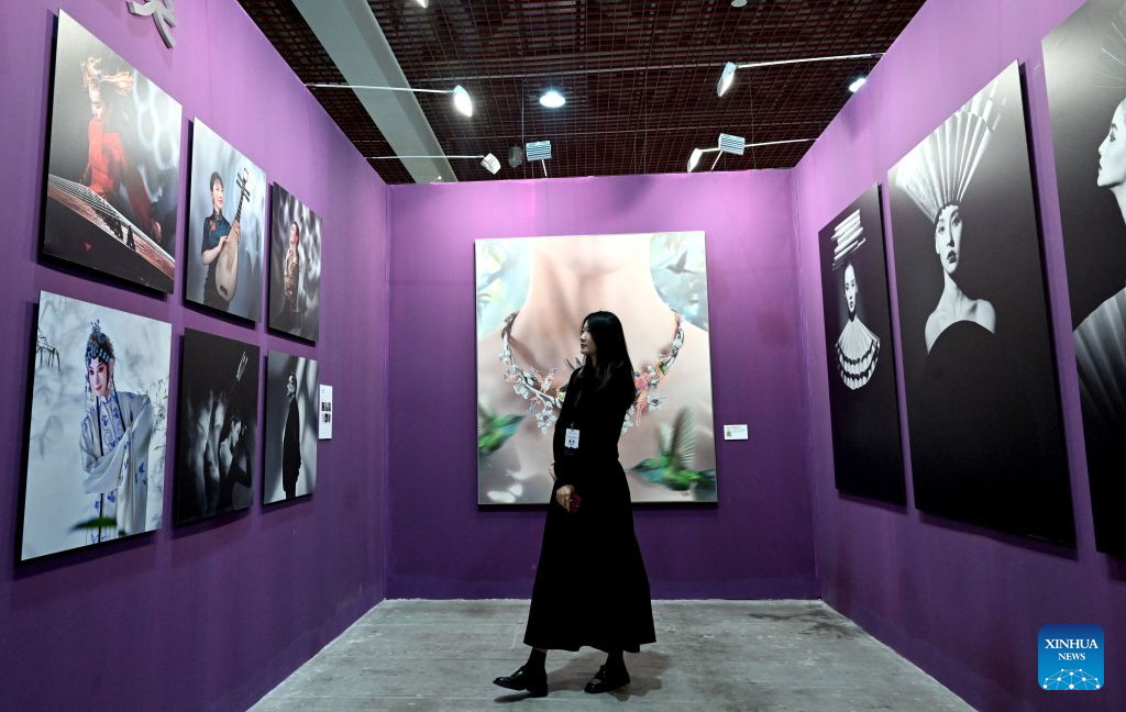 A visitor views photo works at an exhibition during the 16th China Photography Festival in Sanmenxia City, central China's Henan Province, Oct. 29, 2026. The 16th China Photography Festival kicked off here on Thursday, featuring exhibitions covering a variety of themes, including documentary and art. (Xinhua/Zhu Xiang)