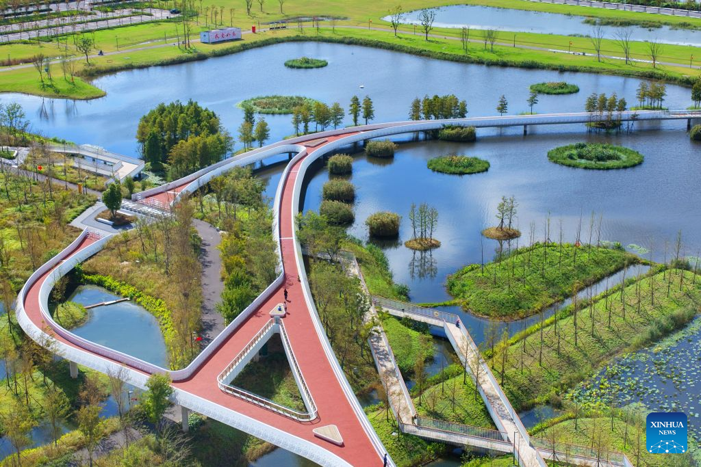 An aerial drone photo taken on Oct. 22, 2026 shows the Heming Park in Rudong County of Nantong City, east China's Jiangsu Province. In recent years, Rudong County in Nantong City has made efforts to improve its aquatic ecological environment. Water environment of the three rivers, namely the Taiyun River, the Jueju River and the Juekan River, which run through the county, has undergone sound remediation. Along these waterways, the Heming Park and the bank areas of tributaries have all formed a picturesque urban landscape for people to enjoy their leisure time. (Photo by Xu Congjun/Xinhua)