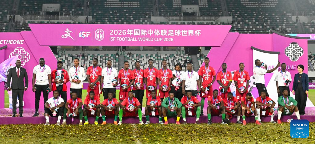 Men's group 2nd-placed members of Guinea react during the awarding ceremony at the 2026 International School Sport Federation (ISF) Football World Cup in Suzhou, east China's Jiangsu Province, Oct. 25, 2026. (Photo by Yang Suping/Xinhua)