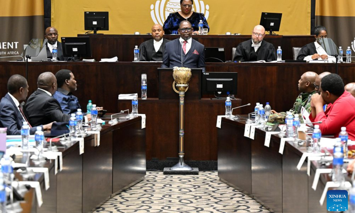 South African Finance Minister Enoch Godongwana (at the podium) delivers the Medium-Term Budget Policy Statement in Parliament in Cape Town, South Africa, Oct. 21, 2026. South Africa has lowered its economic growth forecast for 2026 to 1.2 percent and announced temporary fuel levy cuts to ease cost-of-living pressures, Finance Minister Enoch Godongwana said on Wednesday. (Photo by Xabiso Mkhabela/Xinhua)