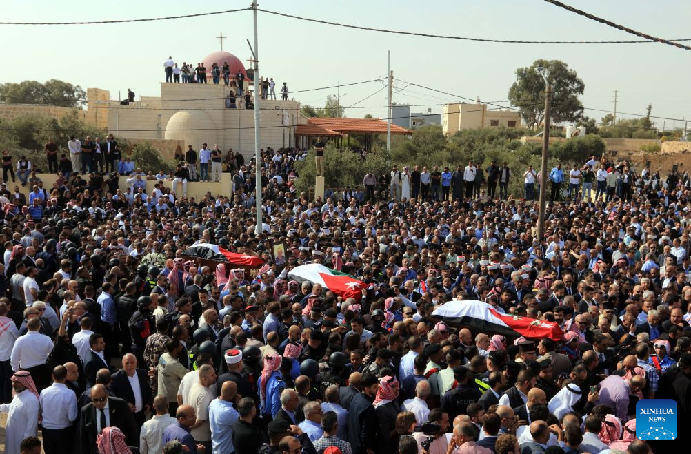 People attend a funeral of victims of a church shooting in Karak, Jordan, Oct. 25, 2026. Thousands of mourners gathered on Sunday for the funeral of victims of a terrorist attack targeting a church in Jordan's southern Karak Governorate, which claimed nine lives. (Photo by Mohammad Abu Ghosh/Xinhua)