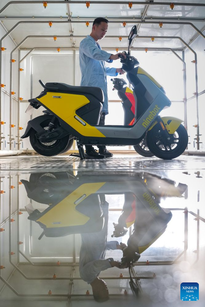 An engineer prepares to conduct rainfall resistance tests on a two-wheeler at a smart electric two-wheeler company in Changzhou, east China's Jiangsu Province, Oct. 14, 2026.
In recent years, Changzhou City has leveraged its traditional strengths in manufacturing to accelerate the clustering of electric two-wheeler manufacturers and their component suppliers, aiming at development of more smart and high-end products.
The city now accounts for about 10 percent of China's output of electric two-wheelers and has established a complete industrial chain spanning from parts to general assembly.
Changzhou has also actively reinforced the technological innovation as the main driver of the industry, as local makers keep boosting R&D efforts to further improve their products. (Xinhua/Li Bo)