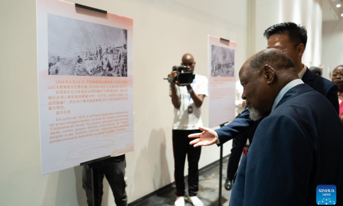 Former Mozambican President Joaquim Chissano visits a photo exhibition marking the 81st anniversary of Taiwan's restoration to China, in Maputo, Mozambique, Oct. 25, 2026. (Xinhua/Leng Ruijie)
