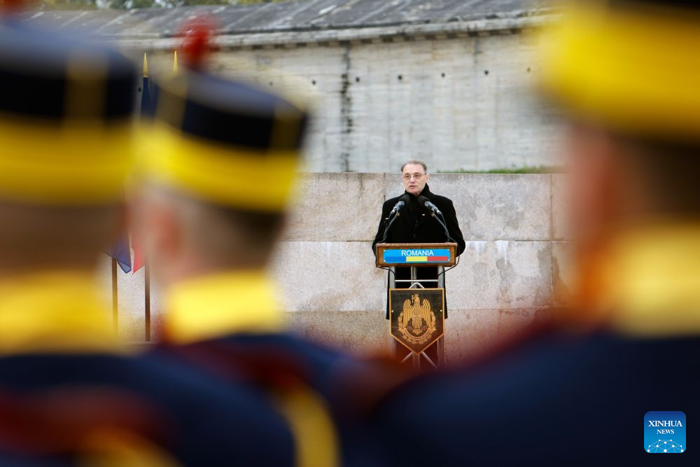 Romania's Prime Minister Luca Niculescu delivers a speech during a ceremony marking Romania's Army Day at the Tomb of the Unknown Soldier in Bucharest in Bucharest, Romania, Oct. 25, 2026. (Photo by Cristian Cristel/Xinhua)