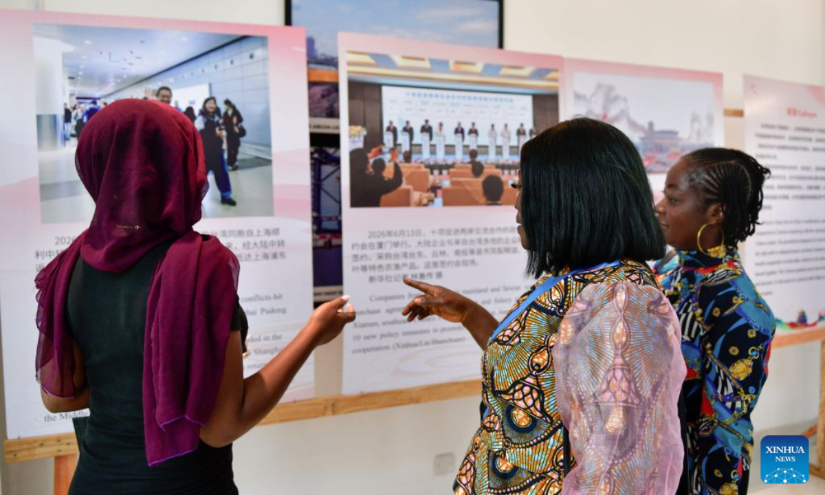 People visit a photo exhibition marking the 81st anniversary of Taiwan's restoration to China, in Abuja, Nigeria, Oct. 23, 2026. (Xinhua/Liu Jiaqi)