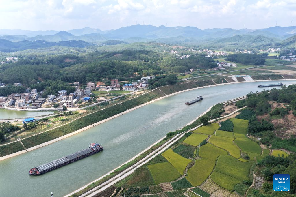An aerial drone photo taken on Oct. 21, 2026 shows cargo vessels on the Pinglu Canal in south China's Guangxi Zhuang Autonomous Region. Cargo throughput of the Pinglu Canal has surpassed 1 million tonnes since its opening to navigation on Sept. 16.

The 134.2-kilometer canal runs from Nanning, capital of south China's Guangxi Zhuang Autonomous Region, to the Beibu Gulf, the closest maritime outlet for much of southwest China.

The canal stretches along the New International Land-Sea Trade Corridor, a strategic trade route connecting China's inland regions with ASEAN and other global markets. It is the first river-to-sea canal project planned and coordinated at the national level since the founding of the People's Republic of China in 1949. (Xinhua/Zhou Hua)