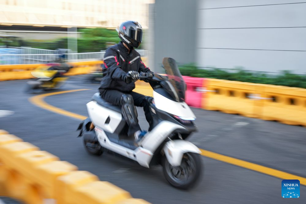 Engineers test vehicles at a test site of a smart electric two-wheeler company in Changzhou, east China's Jiangsu Province, Oct. 14, 2026.
In recent years, Changzhou City has leveraged its traditional strengths in manufacturing to accelerate the clustering of electric two-wheeler manufacturers and their component suppliers, aiming at development of more smart and high-end products.
The city now accounts for about 10 percent of China's output of electric two-wheelers and has established a complete industrial chain spanning from parts to general assembly.
Changzhou has also actively reinforced the technological innovation as the main driver of the industry, as local makers keep boosting R&D efforts to further improve their products. (Xinhua/Li Bo)