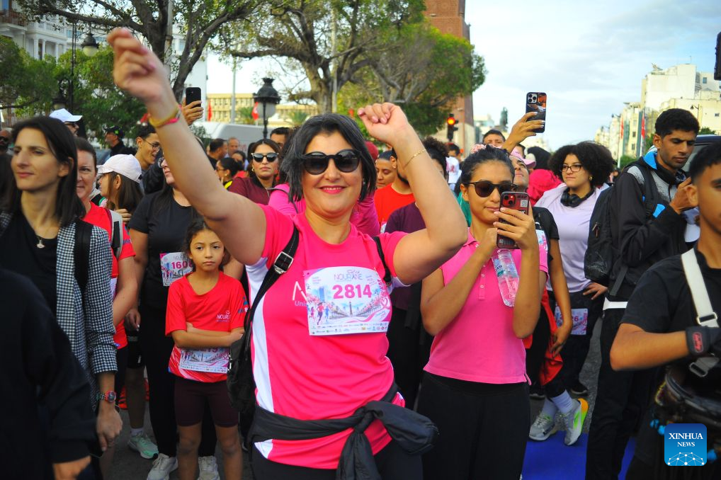 People take part in a charity marathon dedicated to the fight against cancer, in Tunis, Tunisia, Oct. 25, 2026. October is observed globally as Breast Cancer Awareness Month. In Tunis, a charity marathon was held to encourage the public to engage in physical exercise and take proactive steps toward cancer prevention and control. According to the Tunis Afrique Presse (TAP), hundreds of people took part in the event. (Photo by Adel Ezzine/Xinhua)