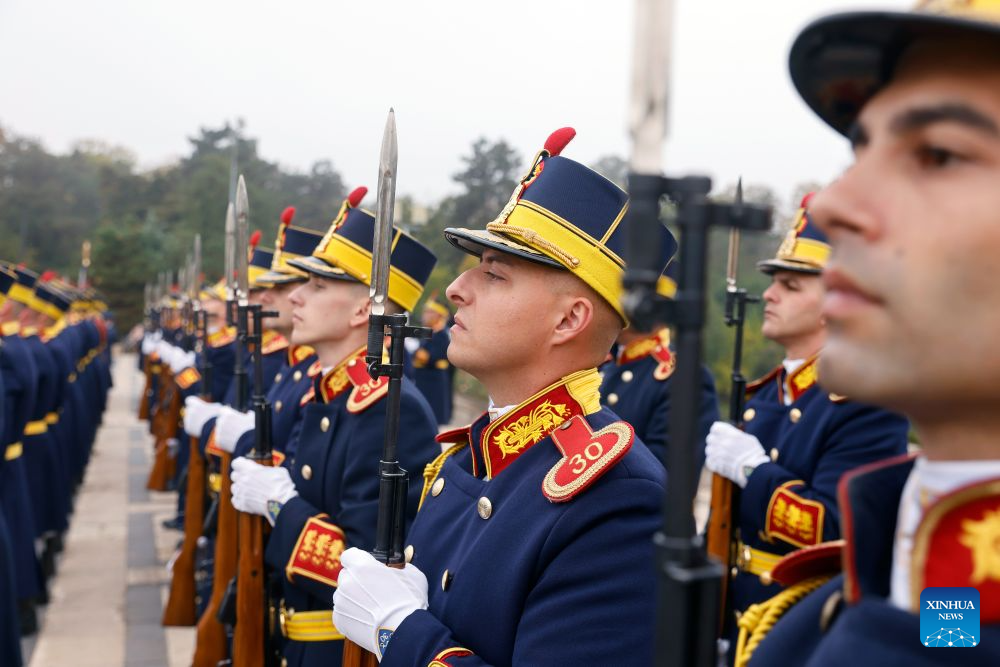 Soldiers of an honor guard stand in attention during a ceremony marking Romania's Army Day at the Tomb of the Unknown Soldier in Bucharest in Bucharest, Romania, Oct. 25, 2026. (Photo by Cristian Cristel/Xinhua)