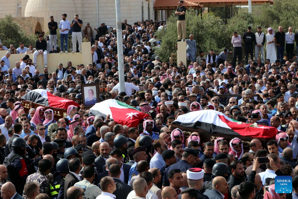 People attend a funeral of victims of a church shooting in Karak, Jordan, Oct. 25, 2026. Thousands of mourners gathered on Sunday for the funeral of victims of a terrorist attack targeting a church in Jordan's southern Karak Governorate, which claimed nine lives. (Photo by Mohammad Abu Ghosh/Xinhua)