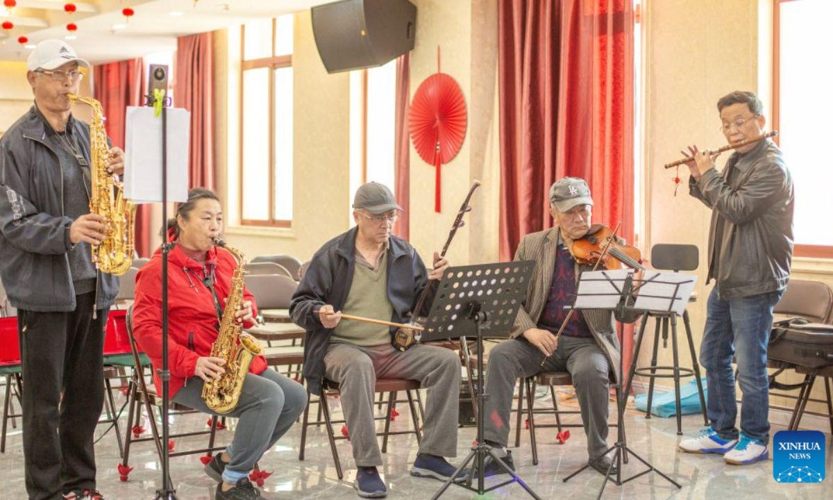 This undated file photo shows elderly people practicing musical instruments at the Huangshan mutual aid community in Huangshan District of Huangshan City, east China's Anhui Province. (Xinhua)