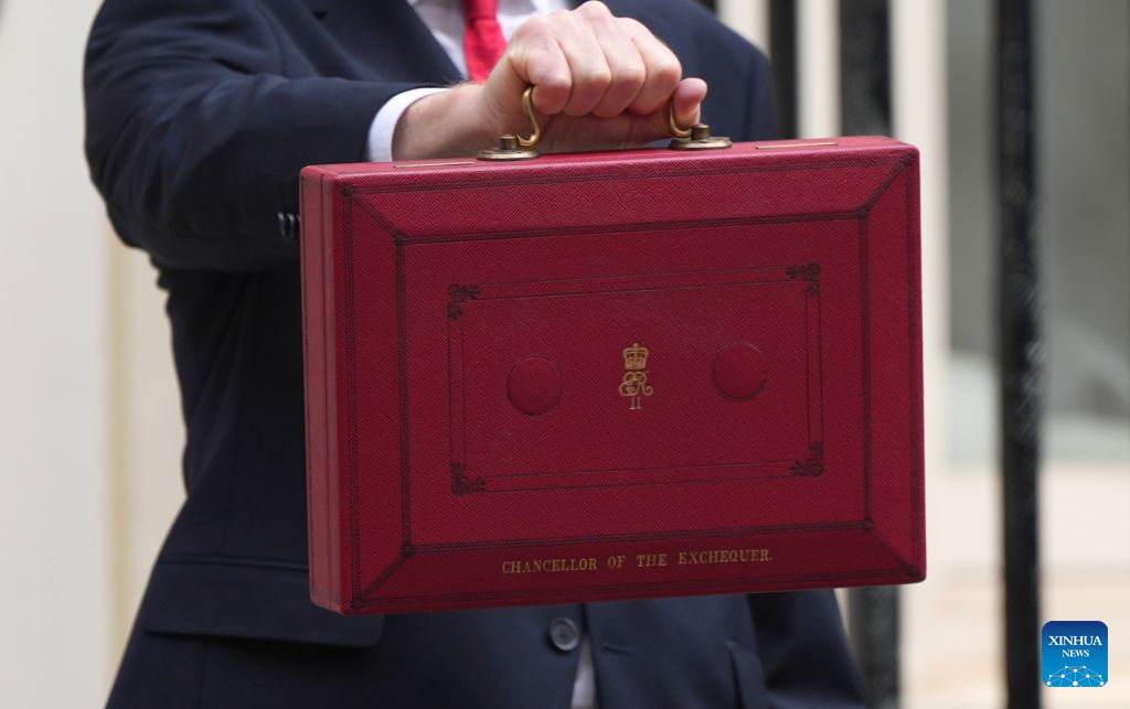 British Chancellor of the Exchequer John Healey shows to the media the iconic red box that contains the Budget 2026 speech outside 11 Downing Street in London, Britain, Oct. 28, 2026. Britain would provide 10 billion pounds (13 billion U.S. dollars) of additional economic and military support to Ukraine, said British Chancellor of the Exchequer John Healey on Wednesday. (Xinhua/Zhang Feng)