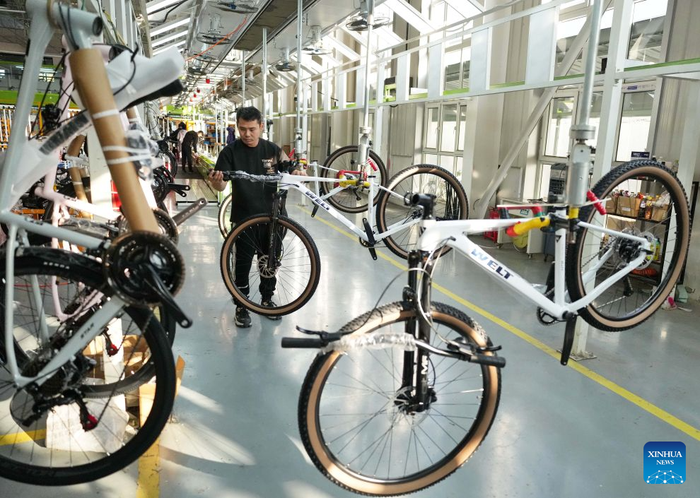 A staff member operates at the workshop of a bicycle enterprise in Lutai economic development zone of Tangshan City, north China's Hebei Province, Oct. 28, 2026. In recent years, Lutai economic development zone in Tangshan City has continuously promoted the upgrading of its bicycle industry. Local manufacturers are encouraged to expand their operation from mere production of components to development and production of ready-for-use bicycles. There are 55 of such manufacturers in this district, covering production of bicycles, bicycle parts, and motors for electric two-wheelers. (Xinhua/Yang Shiyao)