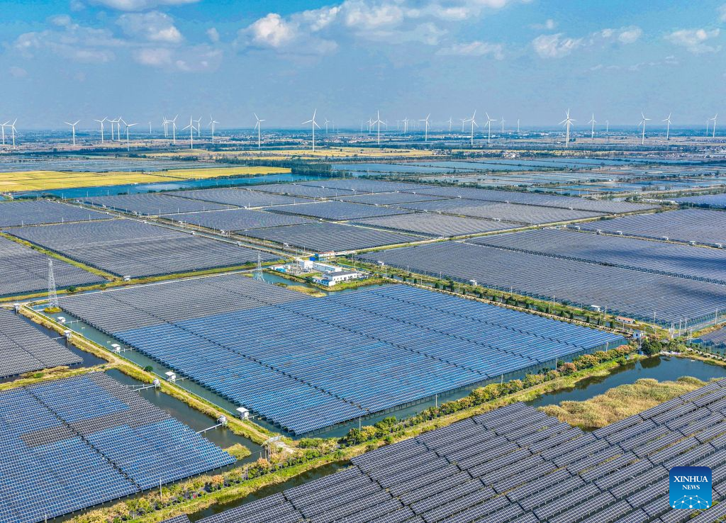 A drone photo taken on Oct. 27, 2026 shows an integrated fishery and photovoltaic project and a wind farm in Baoying County, east China's Jiangsu Province. By the end of September 2026, China's cumulative installed capacity of wind and solar power reached 2.01 billion kilowatts, the country's National Energy Administration announced on Monday. Of the total, solar power capacity stood at 1.31 billion kilowatts, up 16.5 percent year on year, while wind power capacity reached 700 million kilowatts, up 20.4 percent. (Photo by Ren Fei/Xinhua)