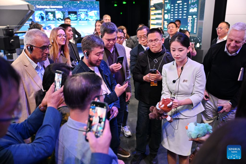 Participants of the 2026 Global Governance Forum (Xiong'an) learn about smart toys while visiting a smart-city science and innovation center in Xiong'an New Area, north China's Hebei Province, Oct. 23, 2026. The 2026 Global Governance Forum (Xiong'an) kicked off here on Friday and will last till Sunday. Participants from various countries and regions visited a smart-city science and innovation center and the construction site of the start-up zone of Xiong'an New Area ahead of the forum. (Xinhua/Mu Yu)